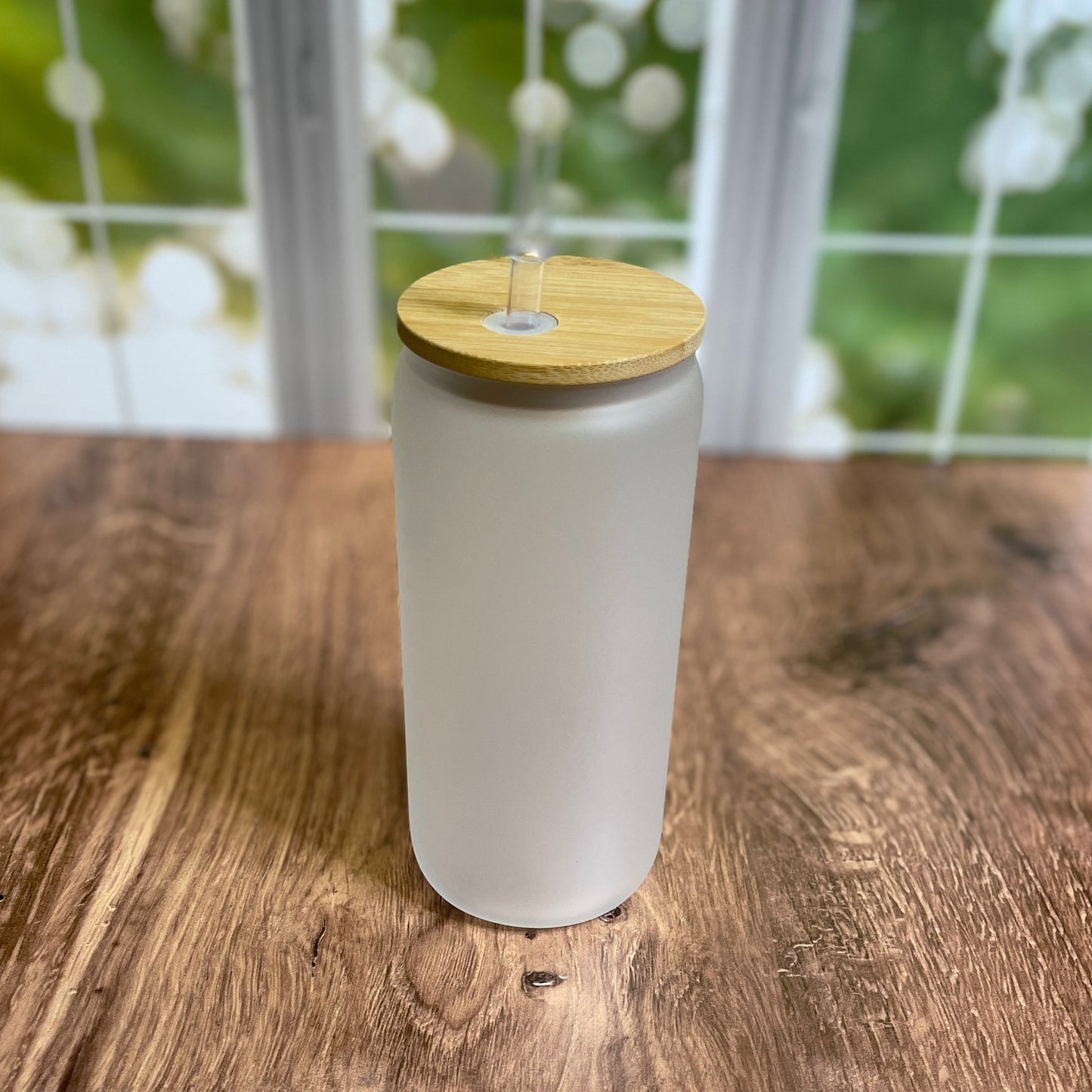 frosted glass jar with bamboo lid and straw