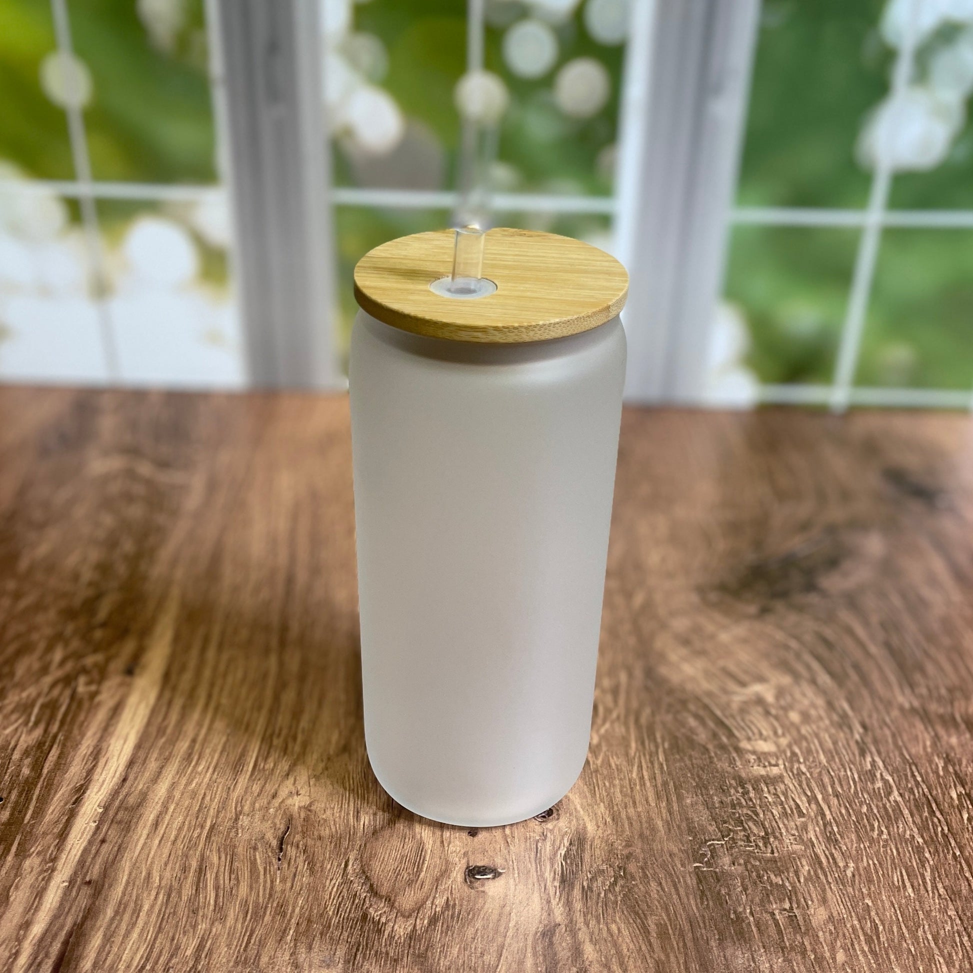 frosted glass jar with bamboo lid and straw