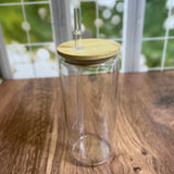 Clear glass jar with bamboo lid and straw